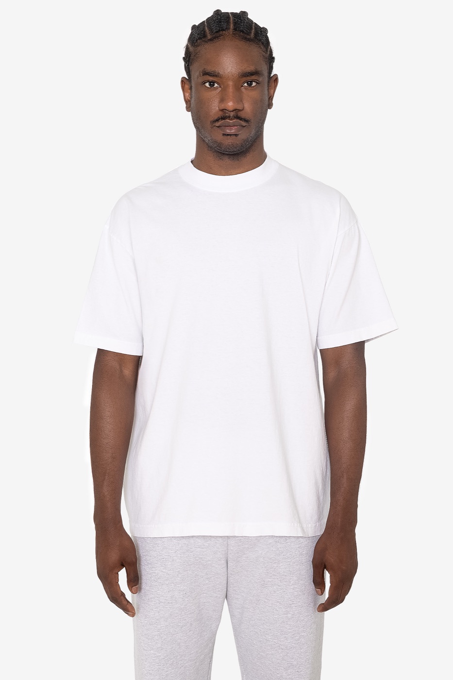 A man in the 1801GD garment-dye crewneck tee in white, from the front
