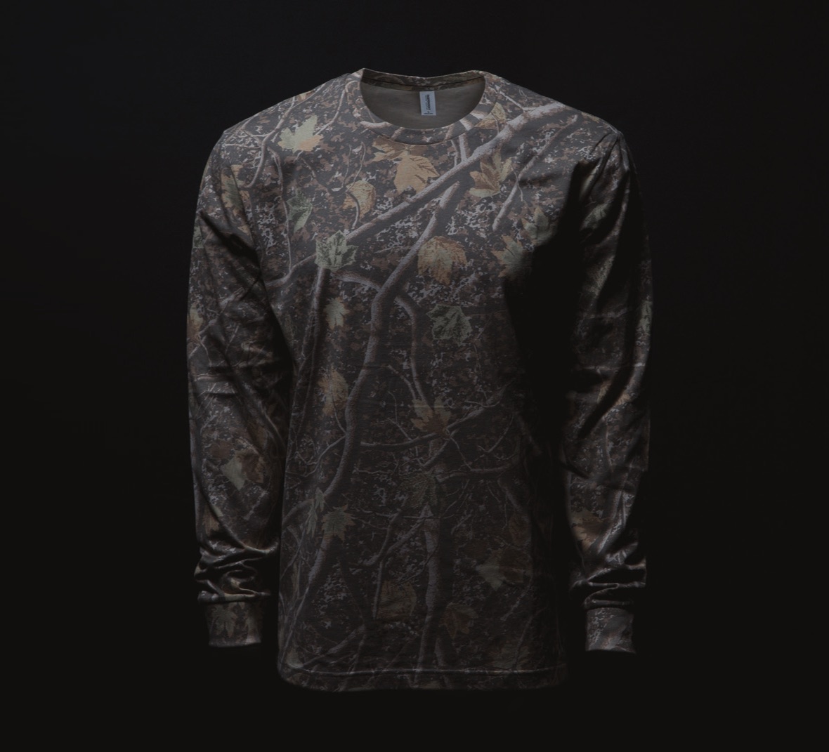 The PRM180LST long sleeve tee in tree camo on a black background