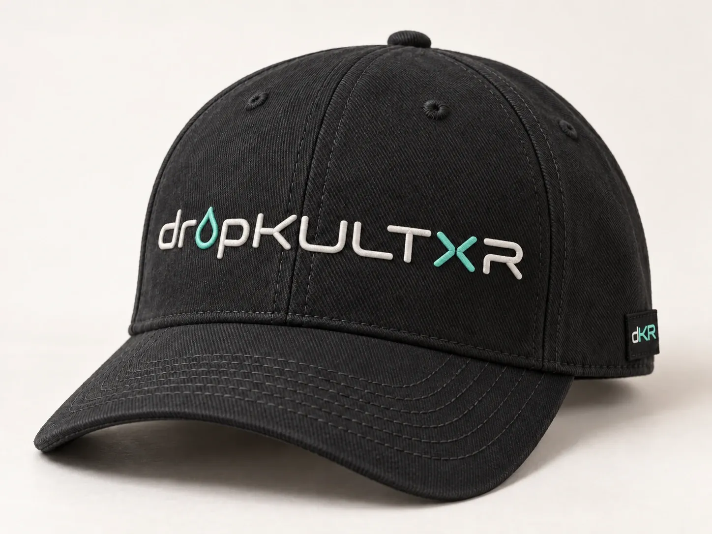 Concept headwear: a black cap with flat bone and mint embroidery and a side tab