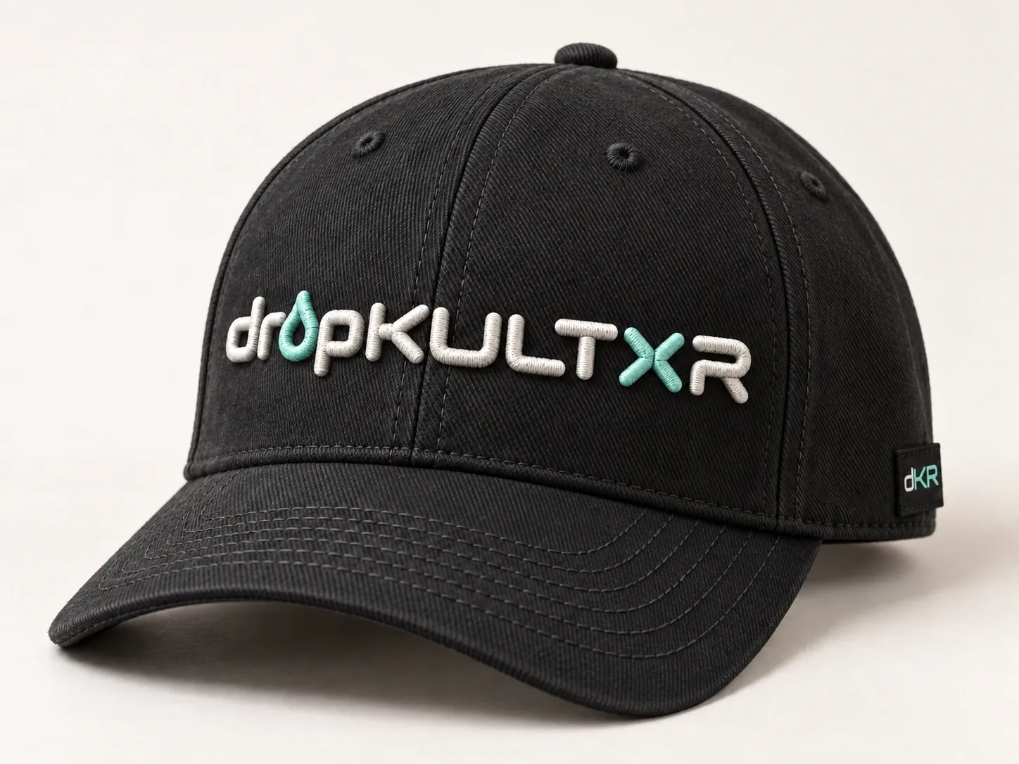 Concept headwear: a black cap with raised puff embroidery in bone with mint accents